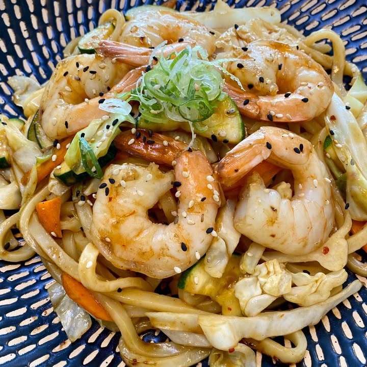 Wok-tossed noodles with prawns, cabbage, carrot, zucchini and sesame
