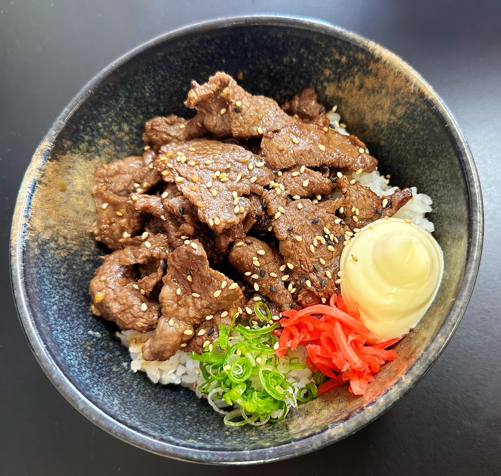 Wagyu Yakiniku Don: grilled wagyu with sesame over rice, spring onion, pickled ginger and mayo